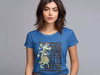 A person in a blue Garment Graphics t-shirt featuring a cartoon alligator holding a basketball and star, with the phrase See you later alligator. With dark hair against a plain backdrop, its an ideal choice for those seeking stylish womens sizing.