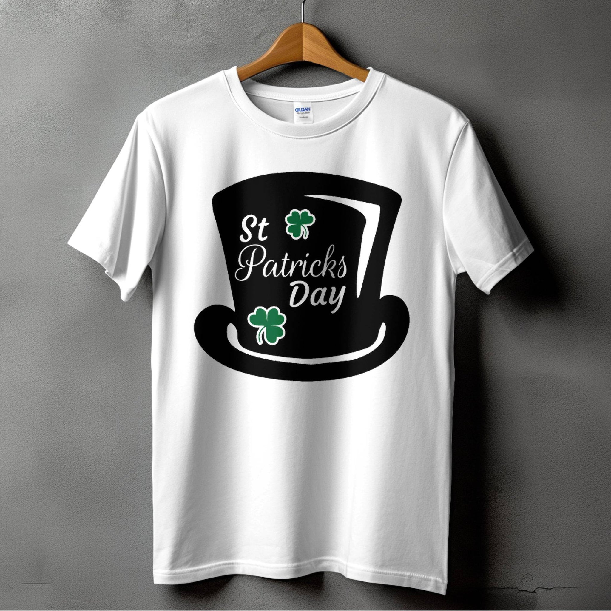 Garment Graphics white T-shirt features St. Patricks Day text, a black top hat, and two green shamrocks reminding of a four-leaf clover, against a gray background—ideal for festivities.