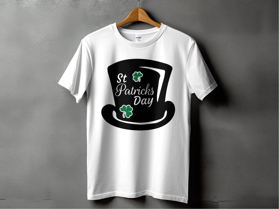 Garment Graphics white T-shirt features St. Patricks Day text, a black top hat, and two green shamrocks reminding of a four-leaf clover, against a gray background—ideal for festivities.