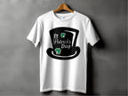Garment Graphics white T-shirt features St. Patricks Day text, a black top hat, and two green shamrocks reminding of a four-leaf clover, against a gray background—ideal for festivities.