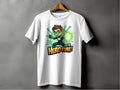The Garment Graphics superhero graphic tee, featured on a hanger, showcases a cartoon character with green gloves and a glowing orb. Bold text states Its Hero Time! Ideal for family sizing, it adds vibrant comic charm to any wardrobe.