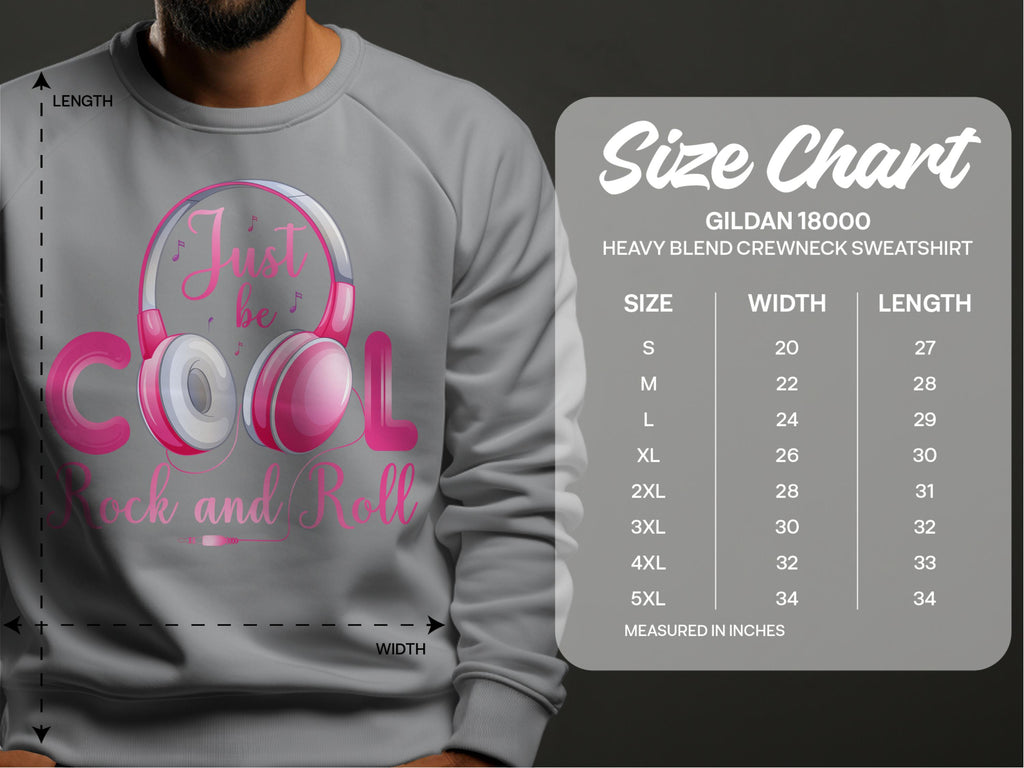 Clad in a trendsetting statement piece, someone wears a gray sweatshirt by Garment Graphics with Just be Cool Rock and Roll in pink headphones. The size chart for the Gildan 18000 Heavy Blend Crewneck Sweatshirt ranges from S to 5XL, ideal for music lovers desiring comfort and style.