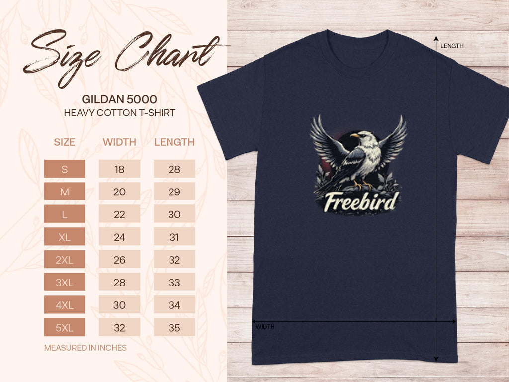Size chart for Garment Graphics heavy cotton tee on wooden background. Displayed is a navy 100% cotton shirt with Freebird eagle graphic. Sizes S-5XL listed with width and length measurements in inches.