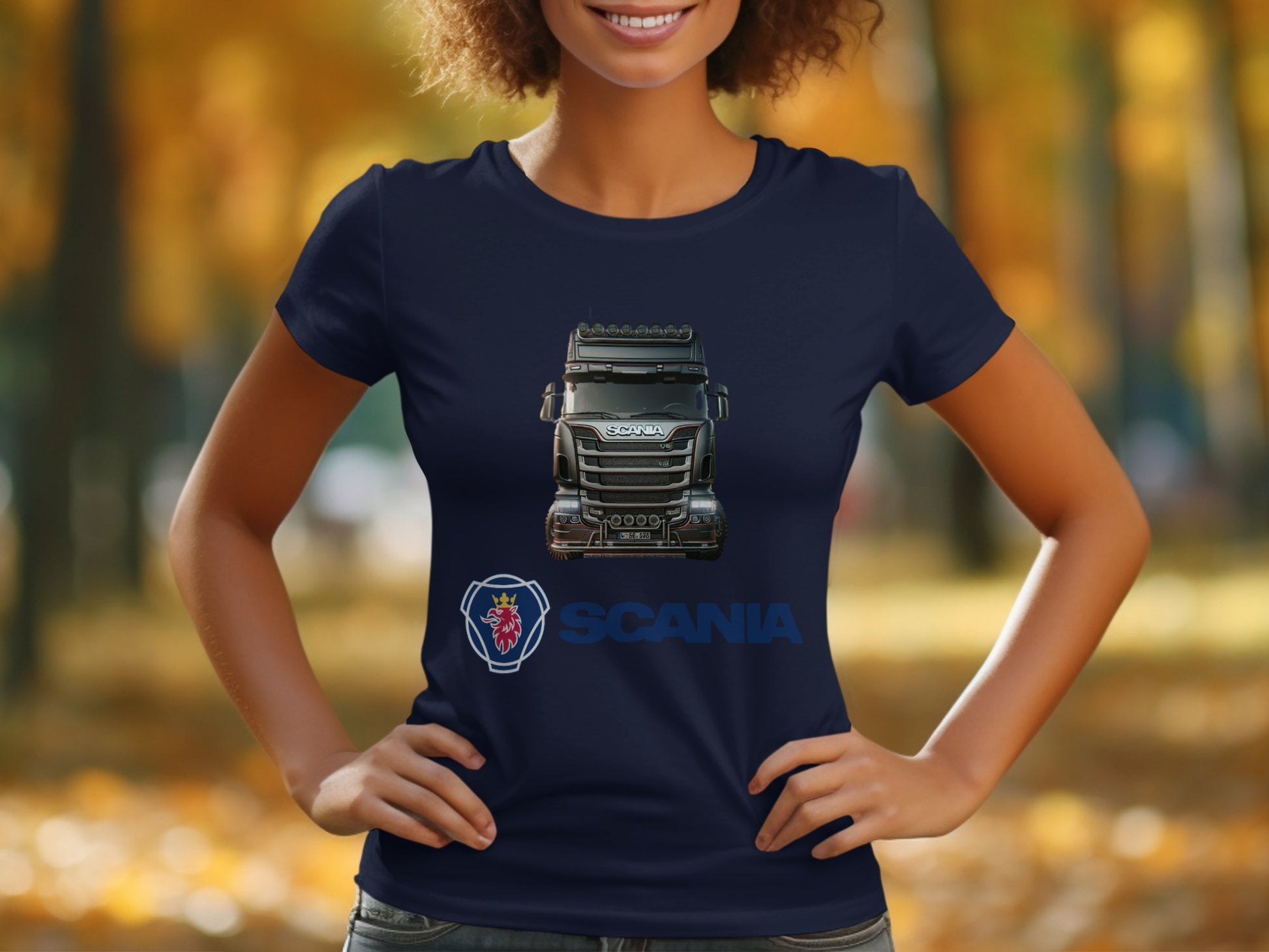In a park with blurred autumn foliage, someone wears a stylish navy blue T-shirt by Garment Graphics, ideal for automotive enthusiasts.