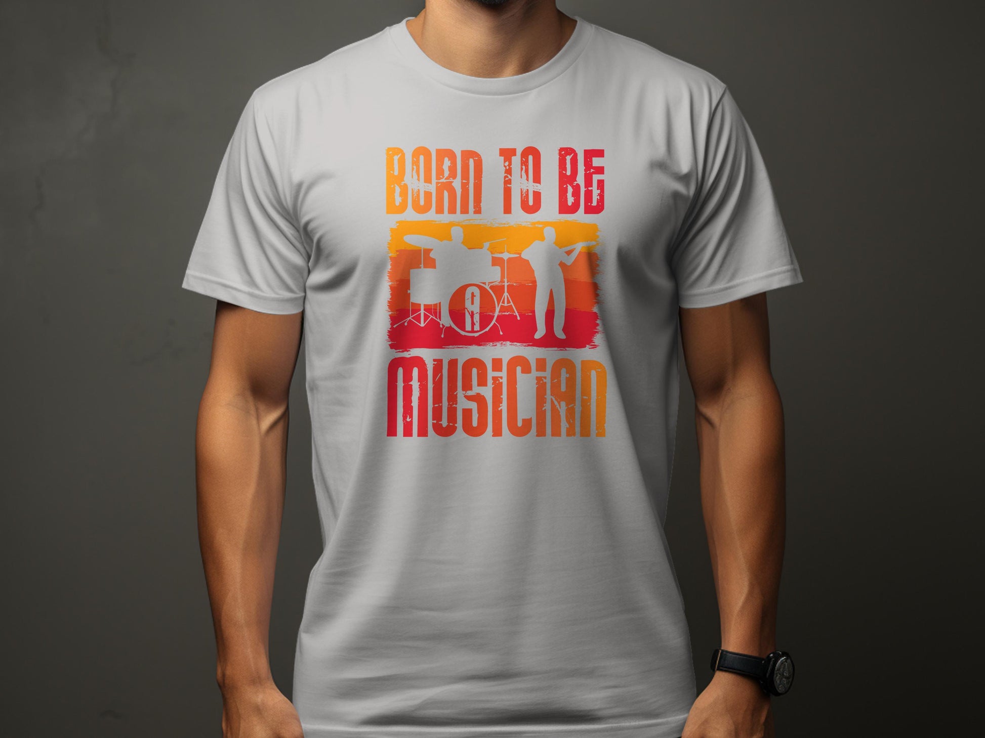 This Garment Graphics Born To Be Musician t-shirt, featuring silhouettes of a drummer and guitarist, boasts vibrant red and orange text on a gray background, celebrating musical artistry. Perfect for music lovers!.