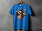 The Garment Graphics Blue T-shirt, ideal for music enthusiasts, features a gorilla in sunglasses holding an electric guitar and making a peace sign. It hangs on a wooden hanger against a plain gray backdrop.