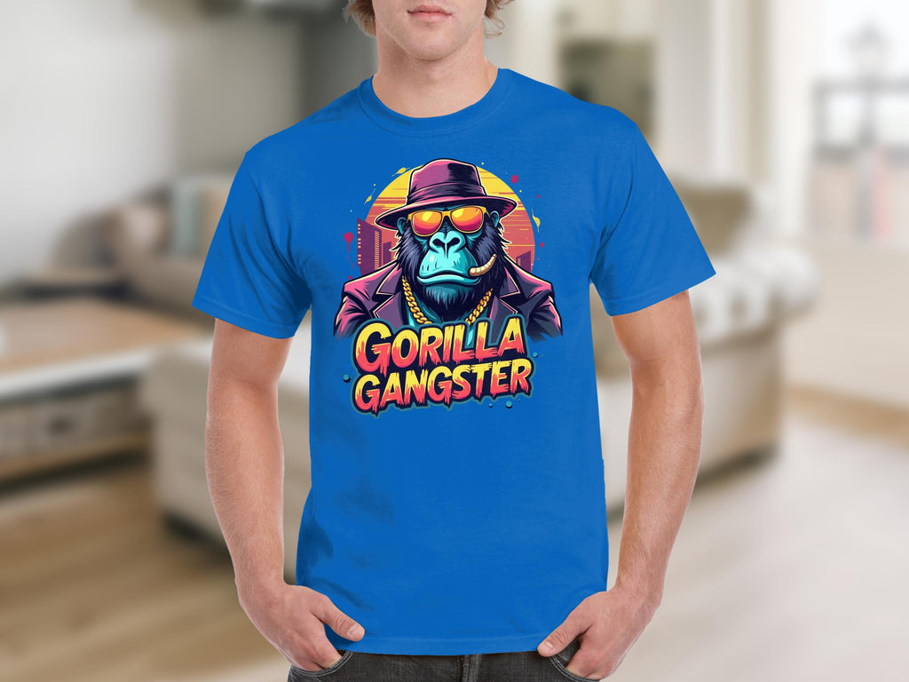 This bold Garment Graphics T-shirt features a gorilla gangster with a hat and sunglasses set against a vibrant backdrop. The text Gorilla Gangster completes the eye-catching design, perfect for fans of unique styles.
