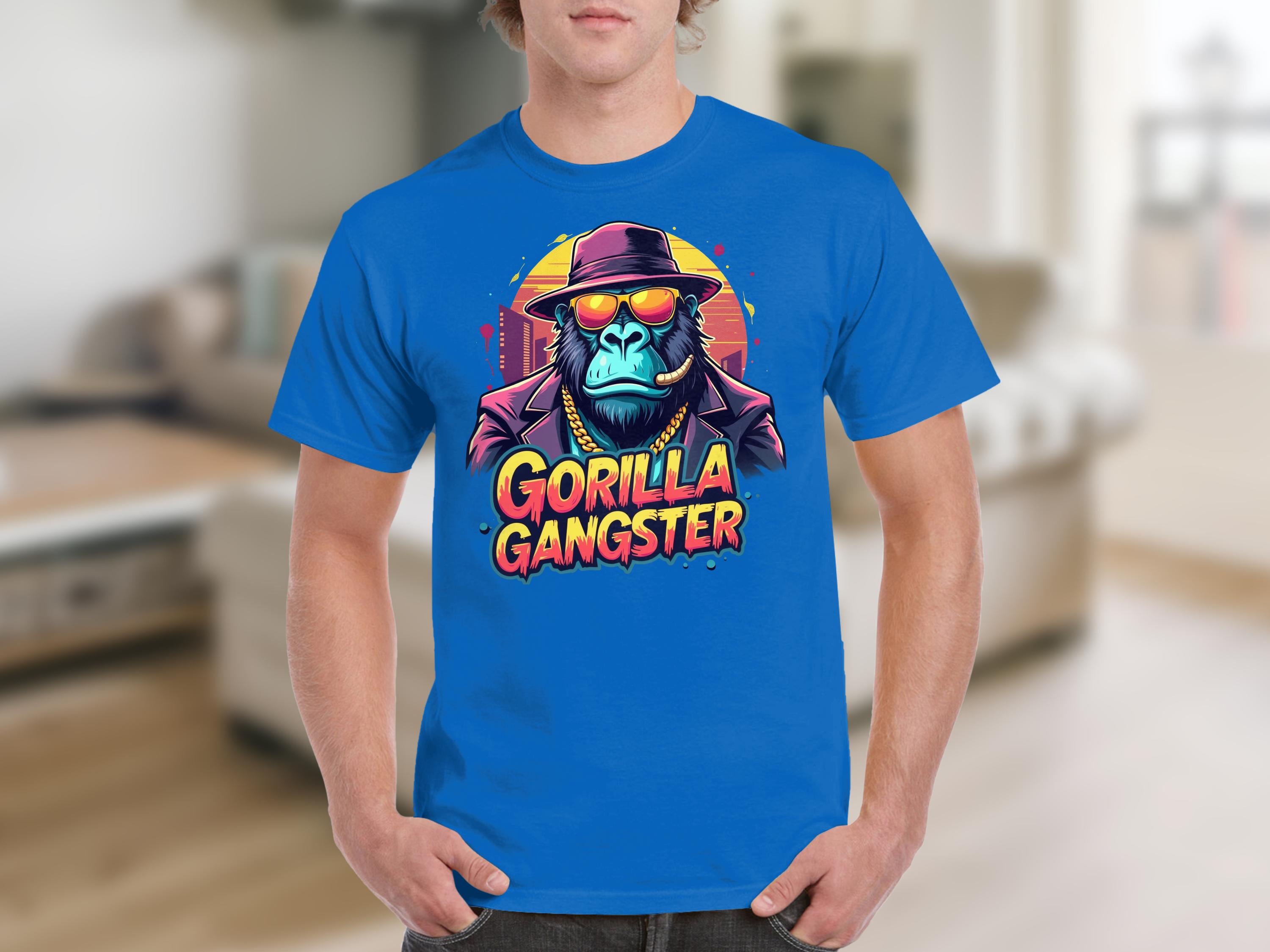 This bold Garment Graphics T-shirt features a gorilla gangster with a hat and sunglasses set against a vibrant backdrop. The text Gorilla Gangster completes the eye-catching design, perfect for fans of unique styles.