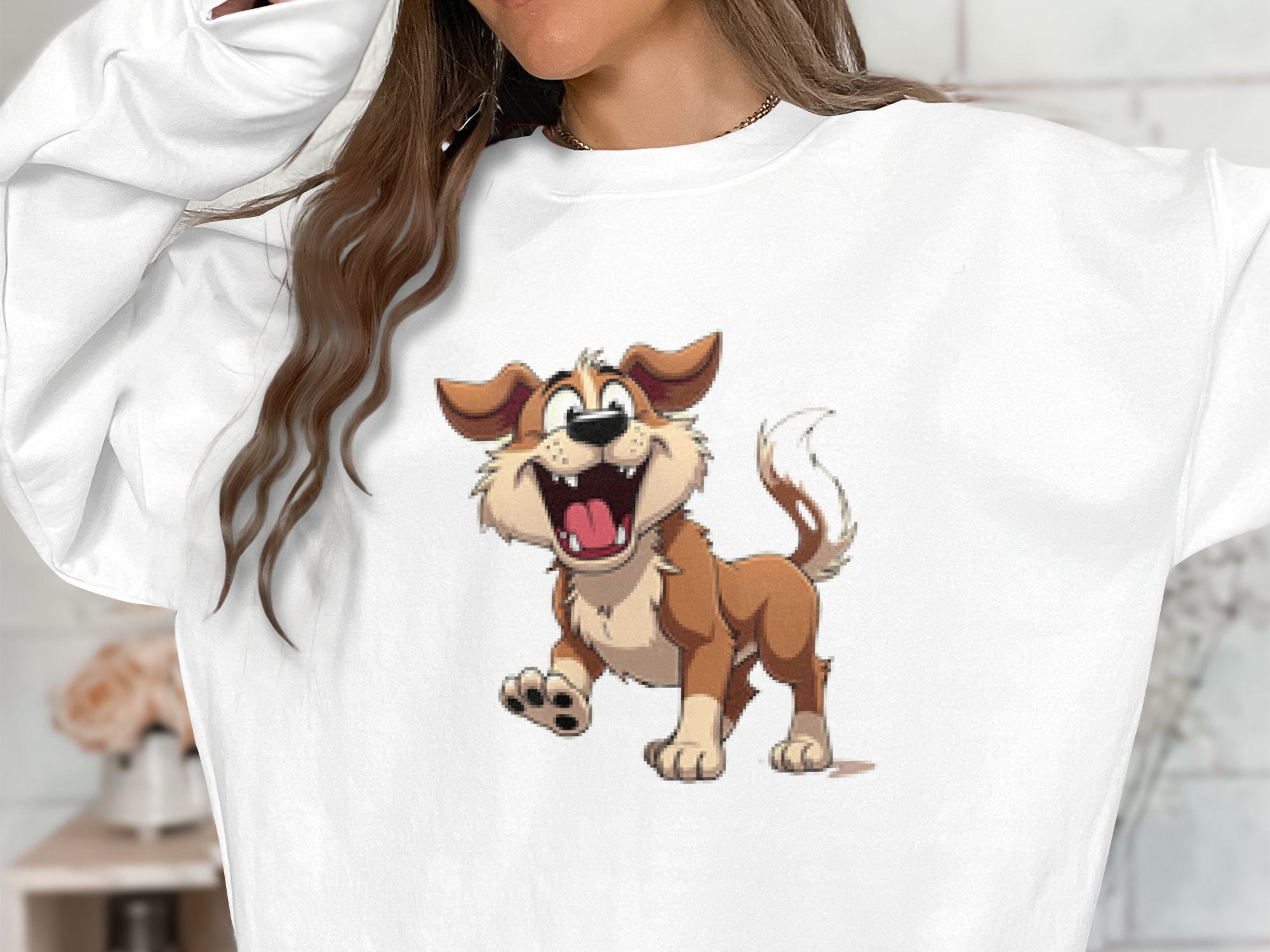 A woman in a cozy, white Garment Graphics sweatshirt showcases a playful, animated dog with brown fur, a red collar, and a wagging tail—ideal for dog lovers. Her long brown hair and raised arms enhance the joyful vibe.