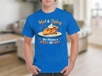 A person is wearing a Garment Graphics blue T-shirt with a Hot and Spicy Pie Design, showcasing a pie slice topped with whipped cream. The shirt says, You Wanna a Piece of Me? The backdrop is a blurred indoor scene.