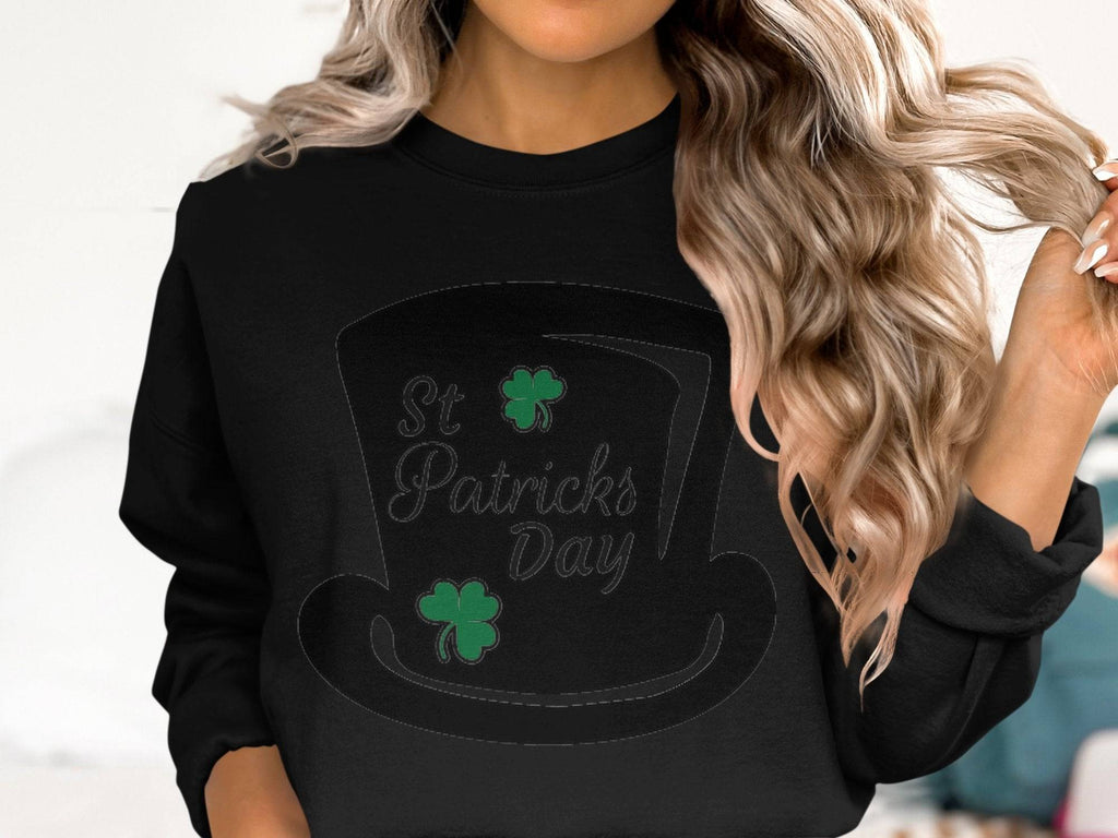 Wavy-haired individuals can get into the festive spirit with Garment Graphics stylish sweatshirt, featuring a large black top hat graphic decorated with green shamrocks and St. Patricks Day boldly displayed.