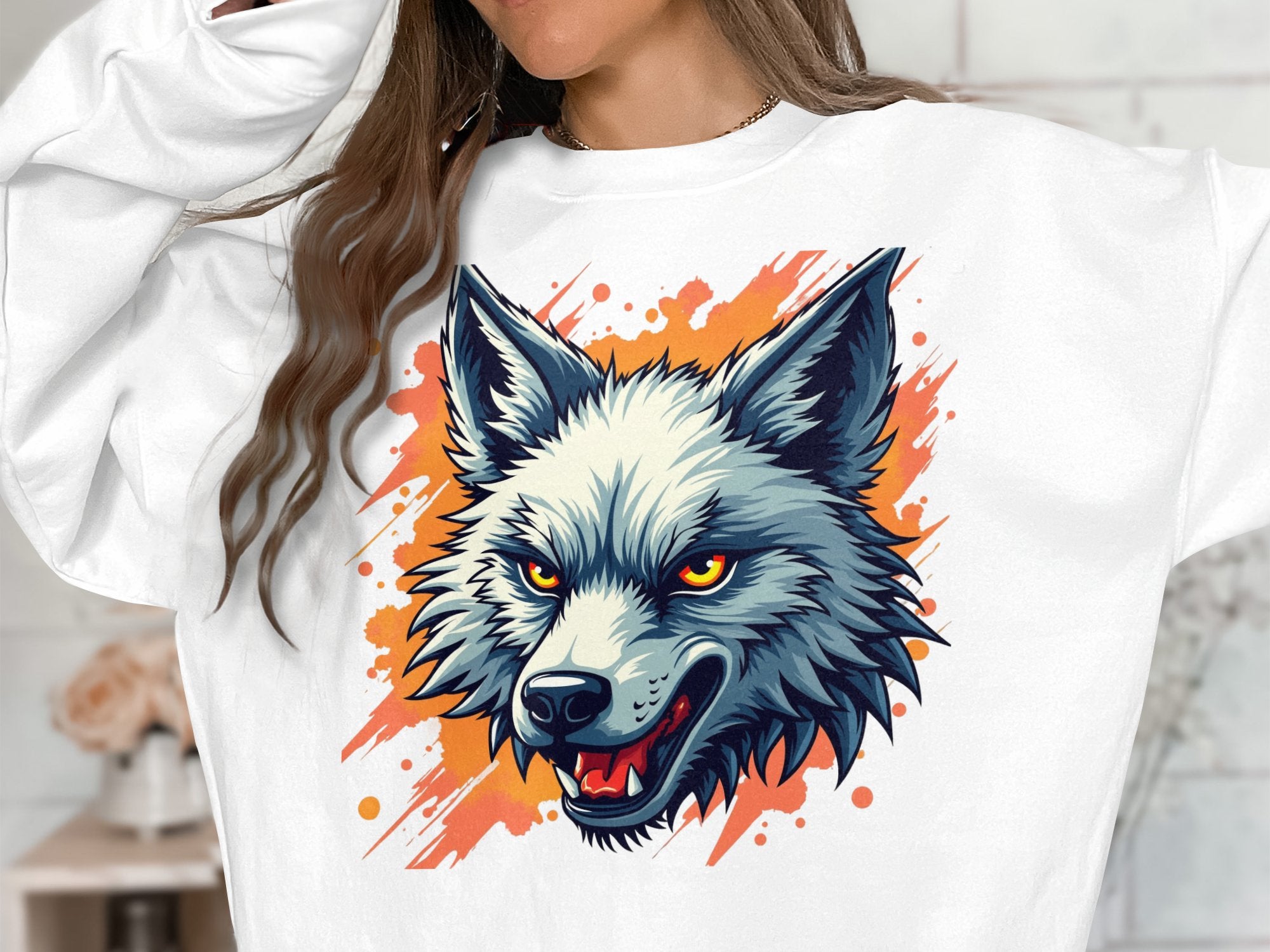 Wearing Garment Graphics fierce wolf sweatshirt, a person makes a bold statement with an intense yellow-eyed wolf head against an orange background, their face partially out of frame.