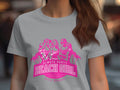 A person dons a light gray t-shirt with a pink graphic of three stylized women and palm trees. It reads Always Party Beach Girl - Kittl Apparel. This Womens Semi-Fitted Tee from Garment Graphics blends style and comfort, perfect for any beach-loving fashionista.