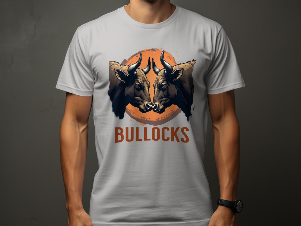 Wearing a Garment Graphics Classic Fit gray T-shirt, one can showcase a bold design with two bull heads against an orange circle and the word BULLOCKS below, making the Bullocks Pintable T-Shirts pop on its dark background.
