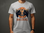 Wearing a Garment Graphics Classic Fit gray T-shirt, one can showcase a bold design with two bull heads against an orange circle and the word BULLOCKS below, making the Bullocks Pintable T-Shirts pop on its dark background.