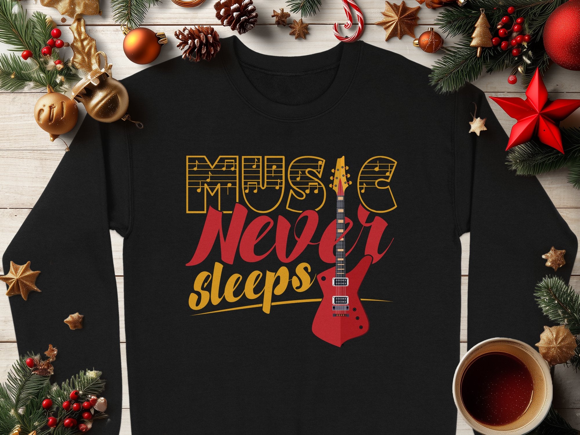 Garment Graphics trendy sweatshirt boasts Music Never Sleeps in vibrant yellow and red with a guitar graphic, ideal for music lovers. It’s adorned with festive décor like pine cones, ornaments, and a cozy coffee cup on a wooden surface.