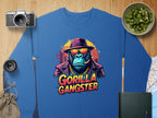 Garment Graphics presents an urban sweatshirt featuring a gorilla in a hat and sunglasses, smoking a cigar. Gorilla Gangster is printed among motifs like a camera, photo lens, cucumber bowl, map, and notebook—ideal for bold aesthetic enthusiasts.