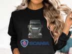 Sporting long, wavy blonde hair, a person wears a Garment Graphics crewneck sweatshirt featuring Scania trucks and logo. Perfect for truck enthusiasts, the design is prominent as the individual is partially visible from shoulders up.