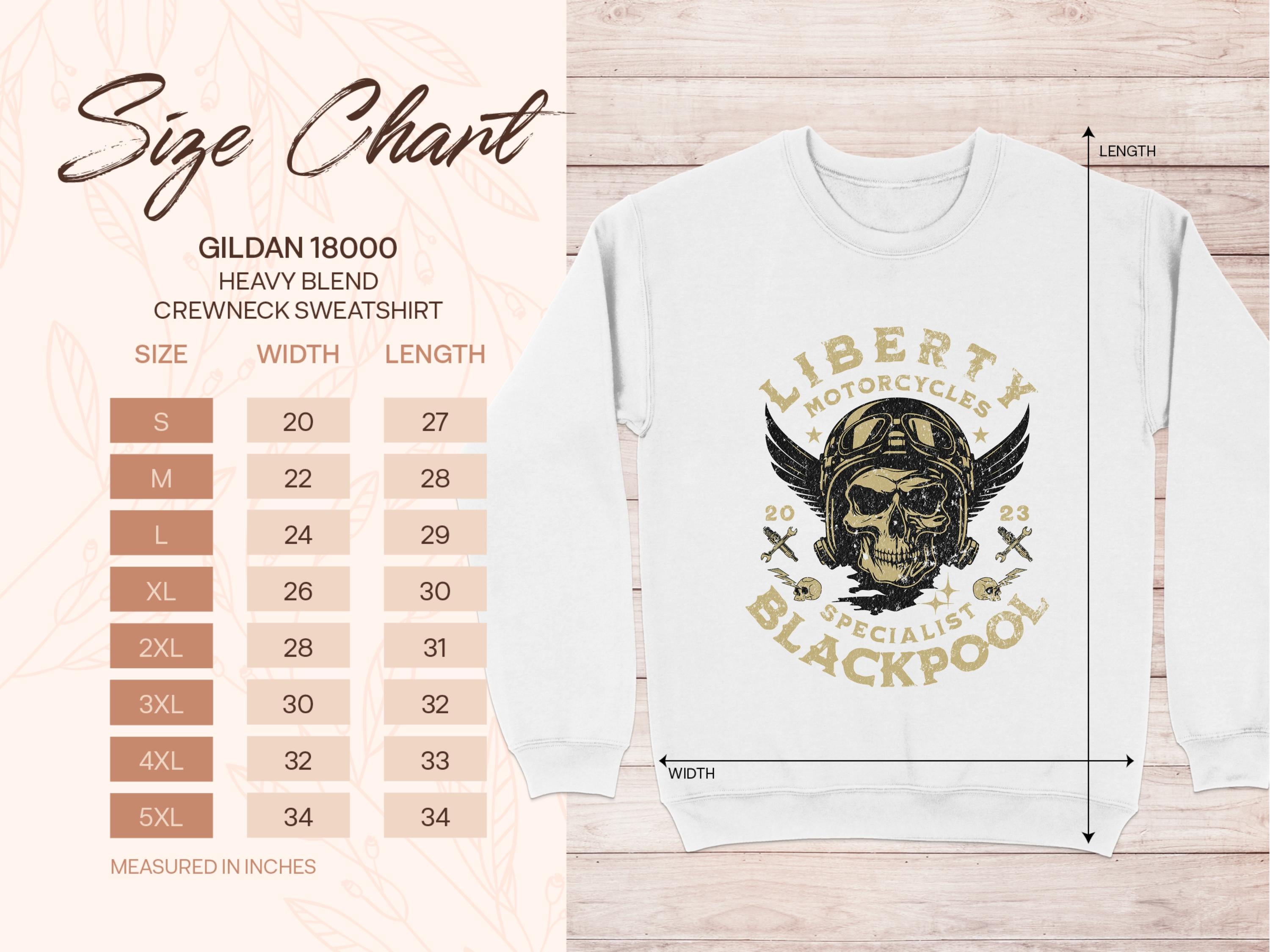 The size chart for the Garment Graphics Gildan 18000 Heavy Blend Crewneck Sweatshirt is shown with an image of a unique white sweatshirt featuring the Liberty Motorcycles Blackpool design with a skull and wings. Chart shows measurements from S to 5XL in inches.