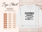 A size chart for the Garment Graphics Gildan 18000 Heavy Blend Crewneck Sweatshirt displays unisex sizes S-5XL with width and length details. The white sweatshirt humorously reads, Cleverly disguised as a responsible adult, with decorative arrows and accents.