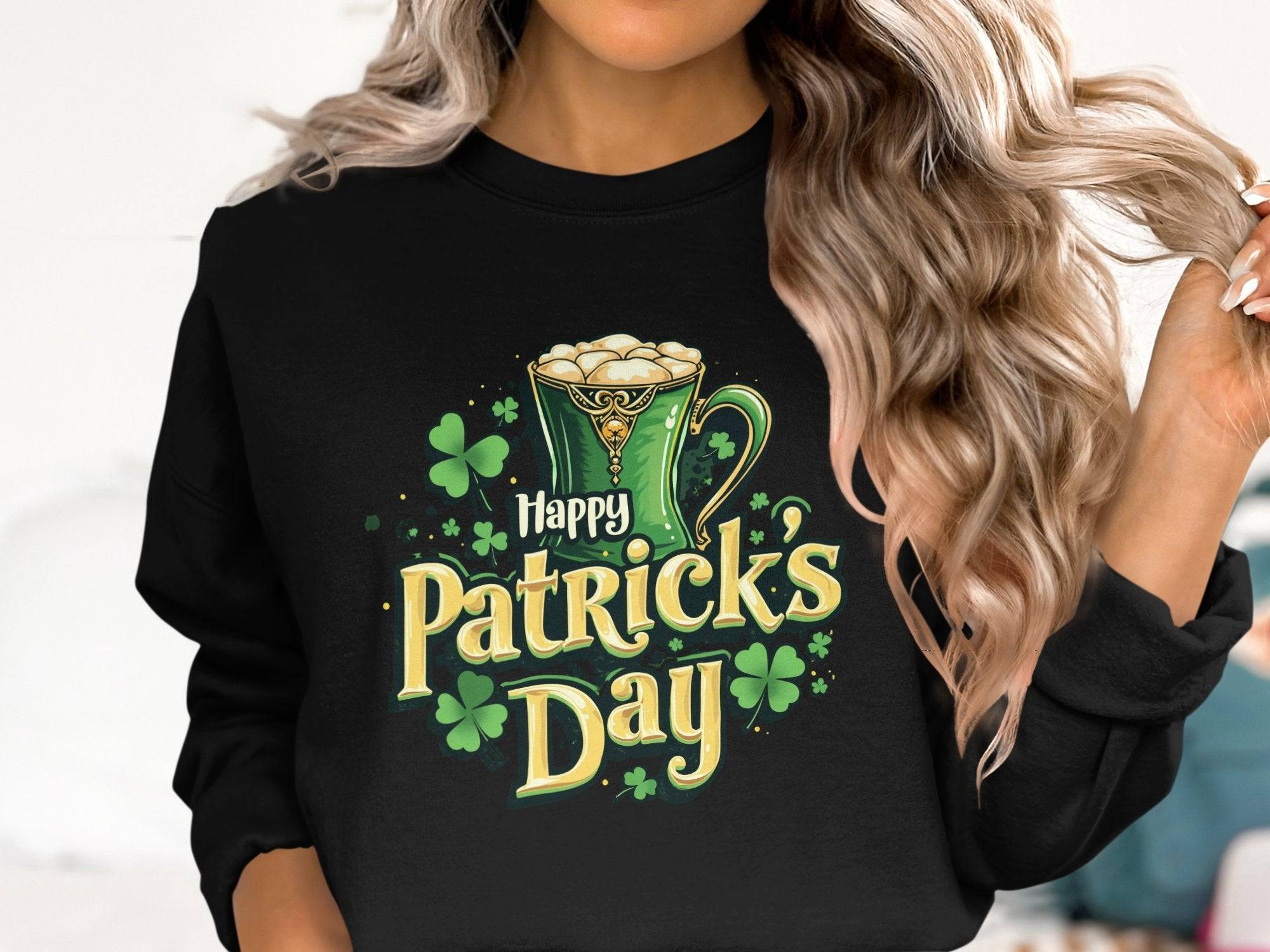 With long, wavy hair, a person sports a vibrant black Garment Graphics sweatshirt featuring a Happy Patricks Day design with a frothy beer mug and shamrocks, ideal for St. Patricks Day celebrations.