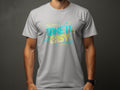 Wearing a Garment Graphics gray Take It Easy T-Shirt adorned with musical notes and arrows in bright neon colors on a dark background, the person radiates a playful vibe as the vibrant design stands out vividly.