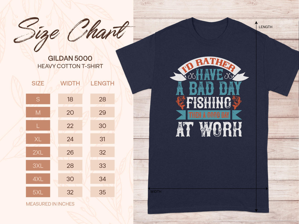 The Garment Graphics blue T-shirt says, Id rather have a bad day fishing than a good day at work in multi-color text, perfect for anglers. A size chart on the left displays the Gildan 5000 heavy cotton T-shirt dimensions (width and length in inches) from S to 5XL.