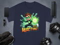 Garment Graphics navy T-shirt showcases a superhero graphic with a cartoon character emitting a green energy blast. Its Hero Time! bursts in bold orange and yellow letters. Surrounded by gadgets, sneakers, and dumbbells, its perfect for family sizing.