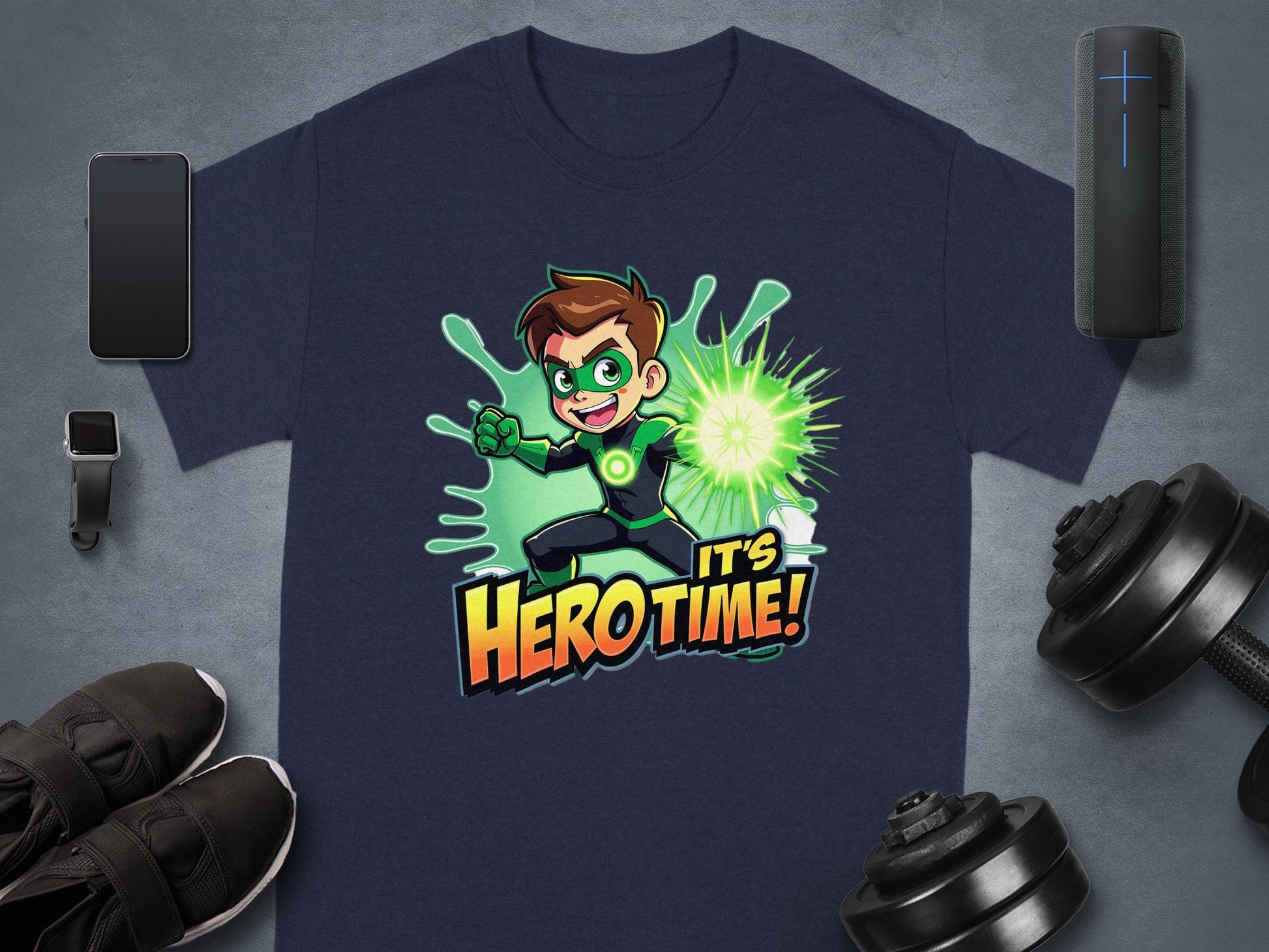 Garment Graphics navy T-shirt showcases a superhero graphic with a cartoon character emitting a green energy blast. Its Hero Time! bursts in bold orange and yellow letters. Surrounded by gadgets, sneakers, and dumbbells, its perfect for family sizing.