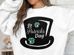 Sporting a Garment Graphics sweatshirt, one showcases a vibrant black top hat graphic, with St Patricks Day artfully placed beside two green shamrocks, capturing the festive spirit perfectly.