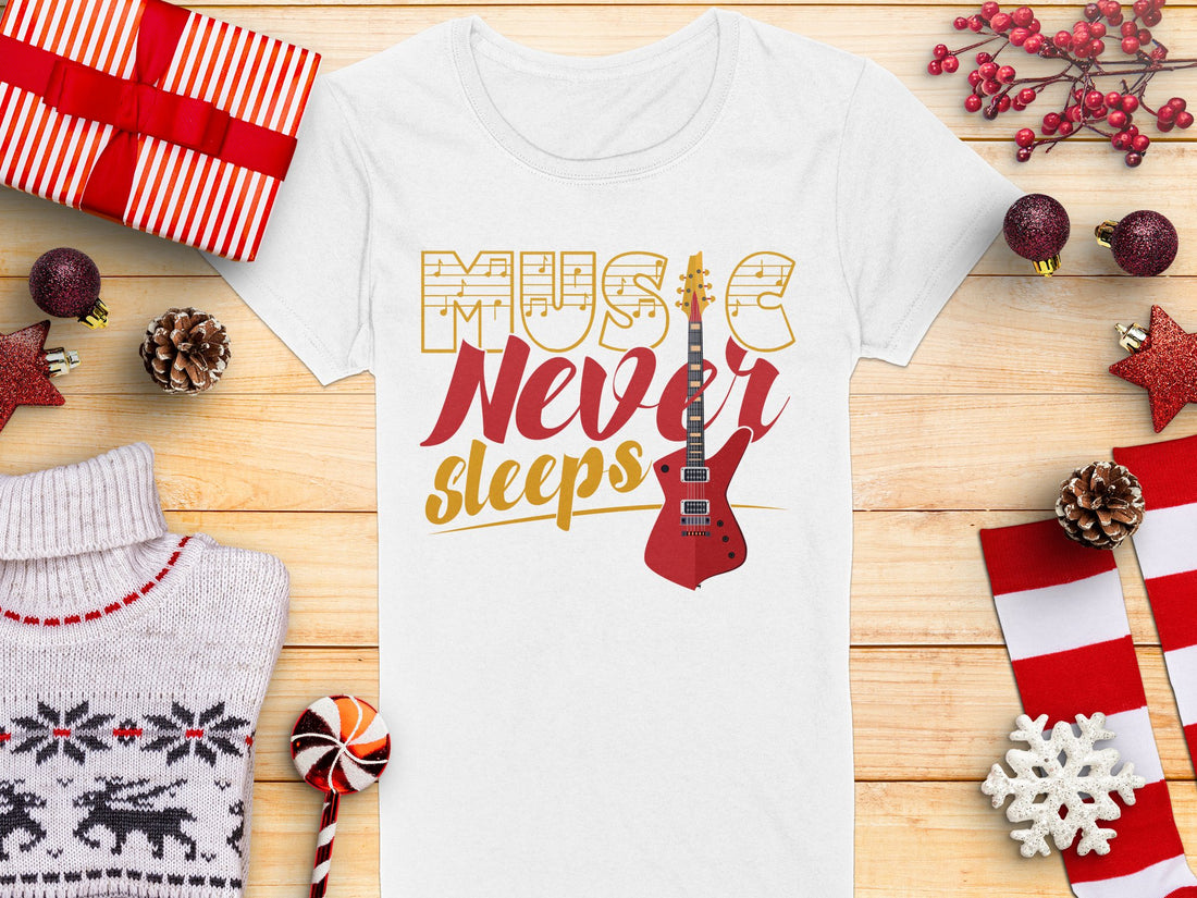 Garment Graphics presents a unique T-shirt with the inspiring Music Never Sleeps slogan and a bold red guitar print. Perfectly laid on a wooden surface, its surrounded by gifts and holiday decor—ideal for guitar T-shirt fans this season.
