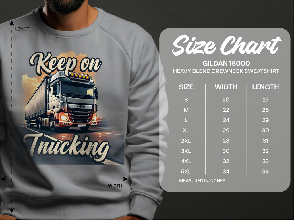 A person wears a Garment Graphics gray sweatshirt featuring a bold truck graphic and Keep on Trucking. The Gildan 18000 Crewneck Sweatshirt size chart offers measurements from S to 5XL in inches for perfect fit guidance, capturing the spirit of the open road.