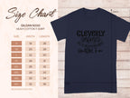 Displayed on the left is a size chart for a Garment Graphics heavy cotton T-shirt (sizes S to 5XL). On the right, a classic dark shirt reads Cleverly Disguised as a Responsible Adult with outward arrows, ideal for any casual outing.