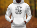 Someone is wearing a white classic-fit hoodie by Garment Graphics, featuring a London vintage car graphic. The design includes the text Classic Vintage Car Club, Classic Garage, and Old School Automotive against a blurred outdoor scene, ideal for car enthusiasts.