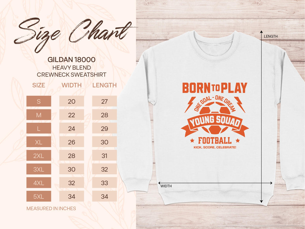 A size chart for the Garment Graphics 18000 Heavy Blend Crewneck Sweatshirt in unisex sizing is shown beside an image of a white football sweatshirt. It features orange text: Born to Play, One Goal - One Dream, Young Squad, Football, Kick, Score, Celebrate. Measurements are in inches.
