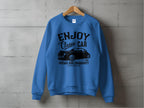 Garment Graphics presents a blue vintage ride sweatshirt featuring ENJOY Classic Car, Vintage Ride Community, Aircooled text and classic car illustration, set against a gray concrete wall background.