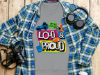 A unisex gray T-shirt from Garment Graphics features colorful Loud & Proud and Hey! Yo Lets Go! Thats How Youre Heard text with images of a megaphone, sunglasses, and sports gear. Ideal for any occasion, this unique piece is perfect for fans of Loud and Proud Sweatshirts.