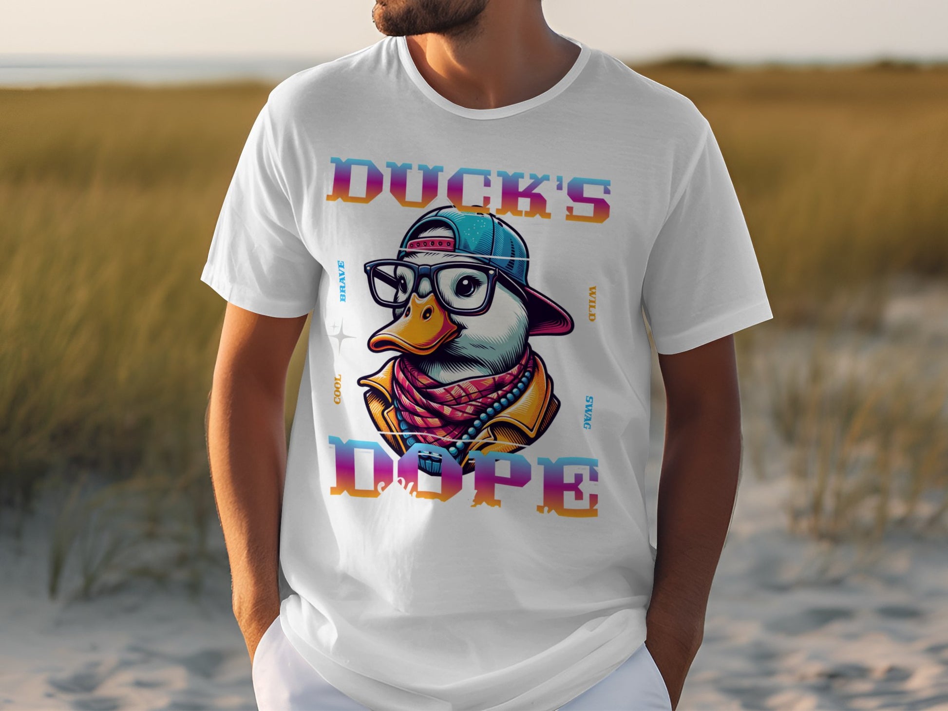 Someone sports a white Garment Graphics T-shirt with a stylized duck in glasses, cap, and scarf. The phrase Ducks Dope frames the image against grass-green backdrop, embodying unique style.