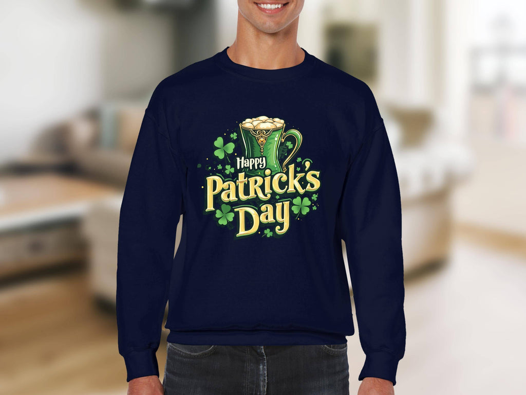 A person is in a blurry indoor setting, wearing a vibrant Happy Patricks Day sweatshirt from Garment Graphics, featuring a festive graphic with a cheerful mug of beer and clovers.