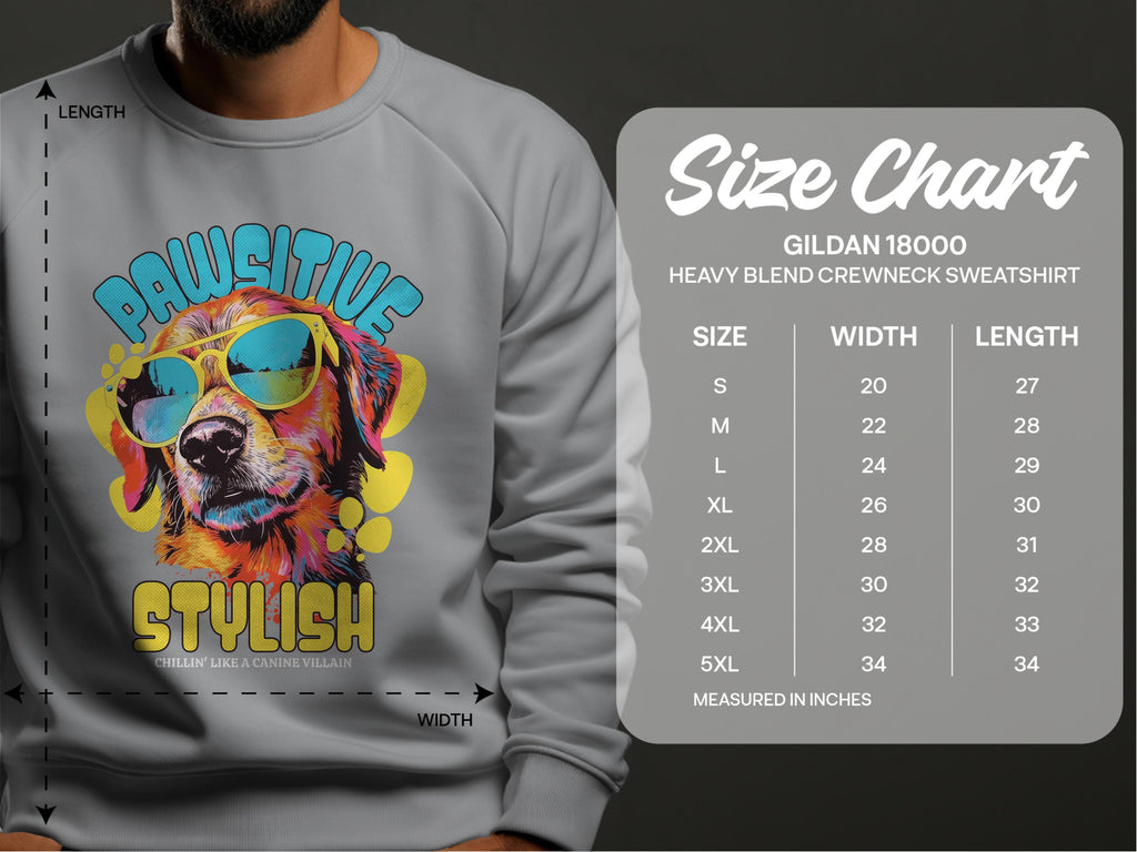 A person sports a Garment Graphics gray sweatshirt featuring a vibrant dog graphic with sunglasses and the text Pawsitive Stylish. The Gildan 18000 size chart shows available sizes from S to 5XL with corresponding width and length measurements. Perfect for dog lovers!.