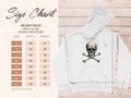 An image showcases a stylish size chart for Garment Graphics Gildan 18500 heavy blend hooded sweatshirt, covering sizes S to 5XL with dimensions. Beside it, a sleek white hoodie with a skull and crossbones design is displayed with detailed dimension lines.