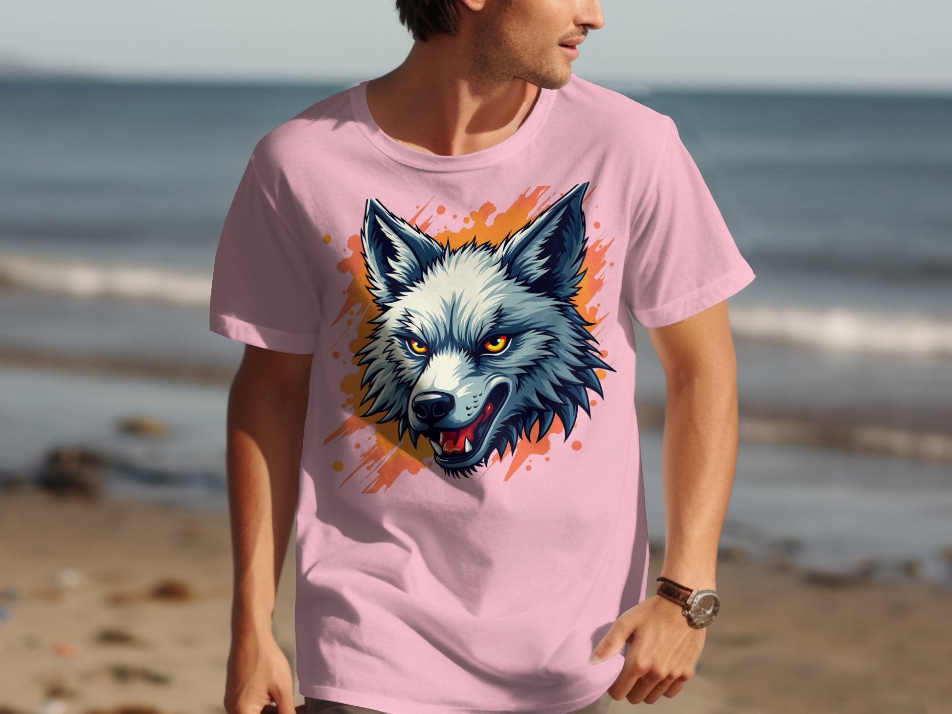 At the beach, someone flaunts a dynamic T-shirt from Garment Graphics with a colorful wolf design, embodying a fearless attitude against the waves and sand backdrop.