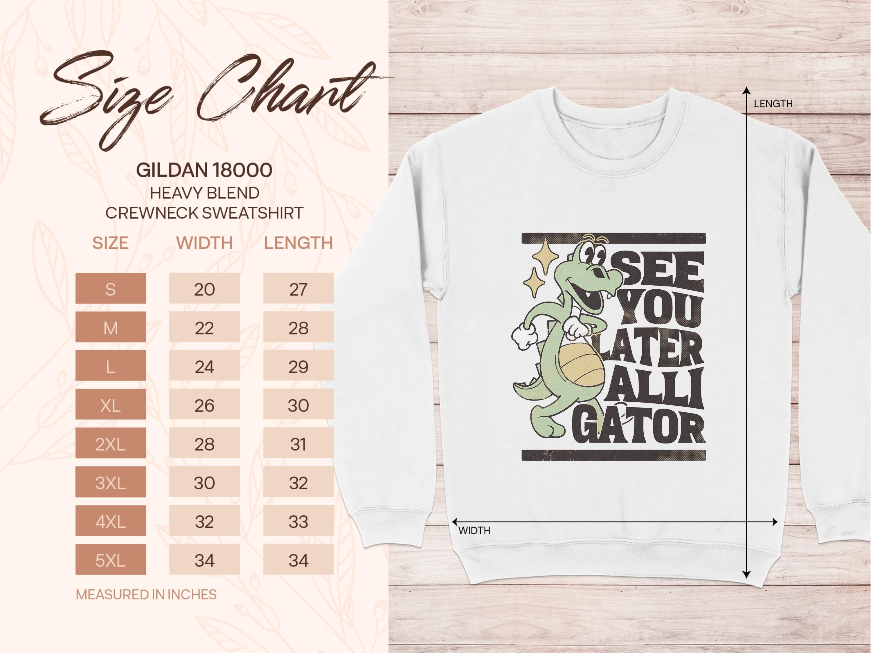 Next to a white Garment Graphics Gildan 18000 heavyweight crewneck sweatshirt featuring an alligator holding a basketball, with the text See you later alligator, theres a size chart with unisex measurements in inches.