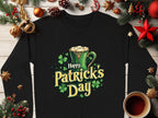 The Garment Graphics black shirt showcases Happy Patricks Day in green and gold letters with a beer mug and shamrocks. Ideal when styled with pine cones, fir branches, ornaments, and a coffee cup on wood, it creates the perfect St. Patricks Day look.