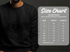 A person wears a sleek black Garment Graphics sweatshirt featuring the Scania Power 8 logo with two griffins and the number 8. Nearby, a size chart shows measurements for a Gildan 18000 Heavy Blend Crewneck, sizes S to 5XL in width and length.