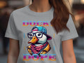 This stylish T-shirt from Garment Graphics showcases a vibrant graphic of a duck wearing glasses, a backward cap, and a scarf, surrounded by the phrase DUCKY DOPE in stylized text, capturing that Cool Brave Wild Swag Duck vibe perfectly.