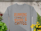 The Garment Graphics sweatshirt showcases Running on Grace & Coffee in vibrant orange. It features a concrete background with shadows, green plants, and colorful flowers. This unisex piece exudes effortless charm.