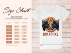 A Garment Graphics white Gildan 5000L heavy cotton womens T-shirt features bold graphics with two bulls and BULLOCKS below. Ideal for casual wear, the size chart lists inches from S to 3XL, detailing width and length per size.