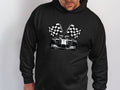 A man wears a black Garment Graphics hoodie featuring a race car design that embodies Formula 1s dynamic spirit. Two crossed checkered flags on the back emphasize the racing theme and capture the excitement of the finish line.