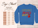 Next to a blue Music Never Sleeps sweatshirt by Garment Graphics, featuring a guitar, theres a size chart for the vibrant Gildan 18000 heavy blend crewneck. It displays sizes S-5XL with width and length in inches, ideal for music lovers.